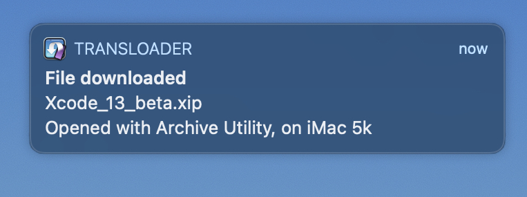 A push notification on macOS, indicating that the download of Xcode has finished on the iMac and was unpacked.