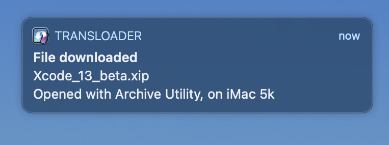 A push notification on macOS, indicating that the download of Xcode has finished on the iMac and was unpacked.